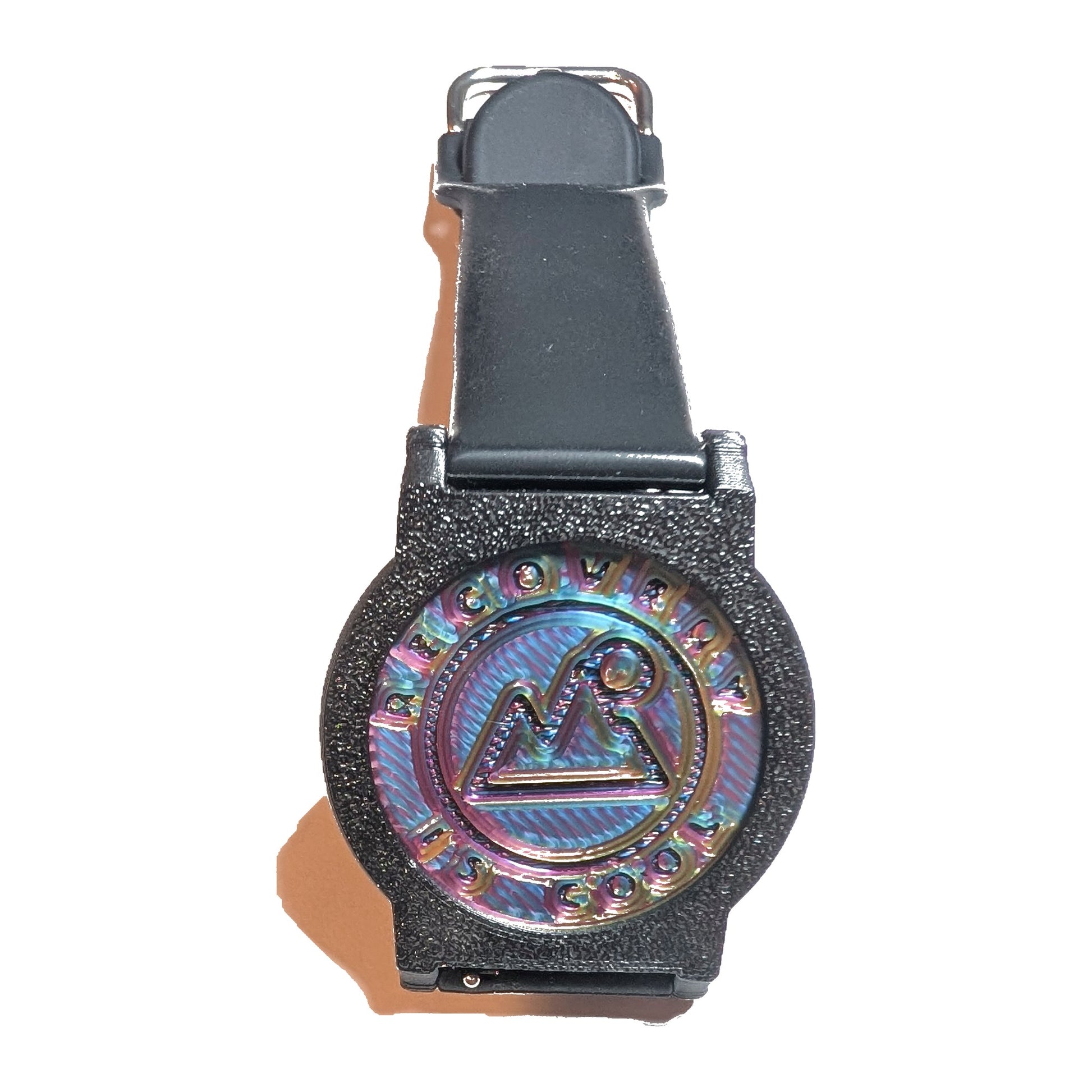 Recovewrist recovery milestone band worn watch-style — black band with a holographic recovery coin in a 3D-printed bezel