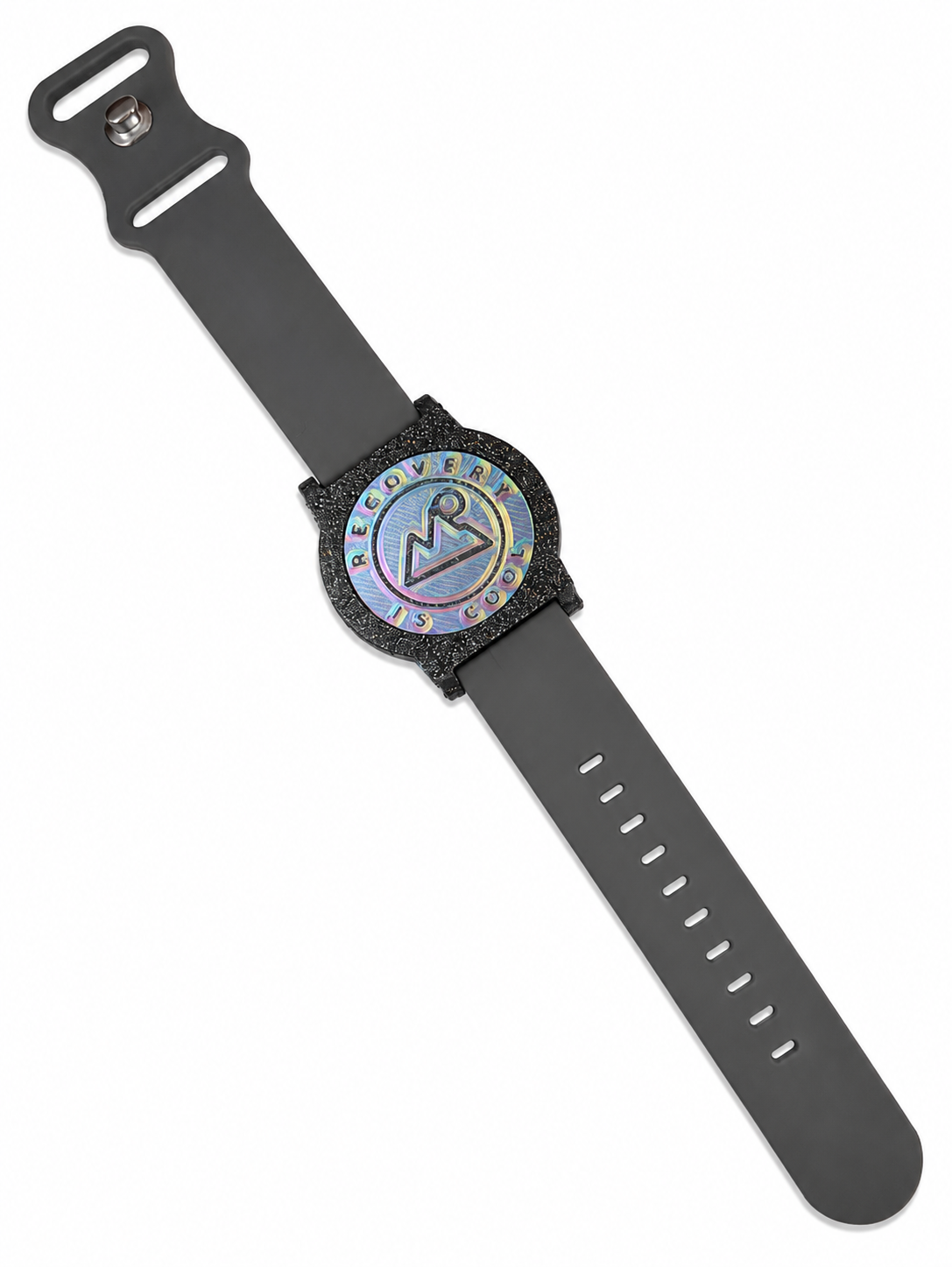 Recovewrist milestone band in grey, worn watch-style with the iridescent ‘Recovery Is Cool’ recovery coin in a speckled granite bezel — made in Colorado